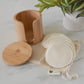 Bamboo storage box with stacked hemp cotton rounds and drawstring bag