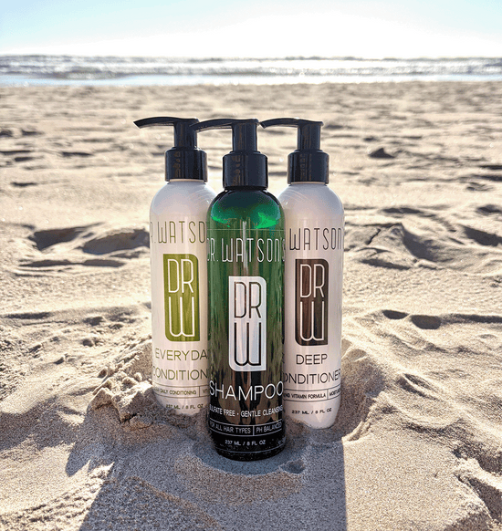 Trio of pump bottles: dark green deep conditioner and white everyday shampoo/conditioner.