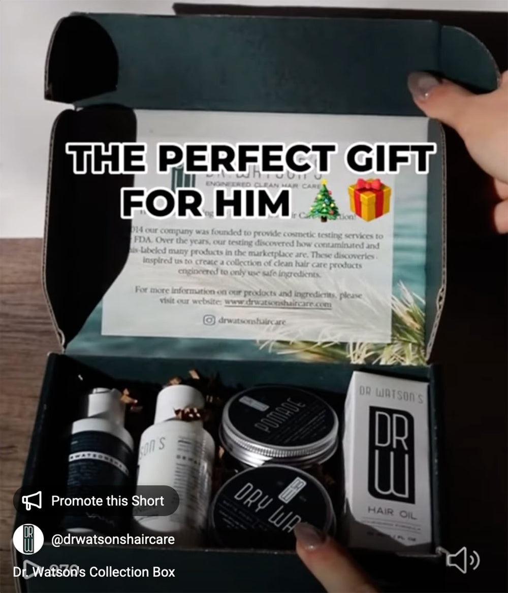 Box of hair care products with a label 'The Perfect Gift for Him' held by a hand.