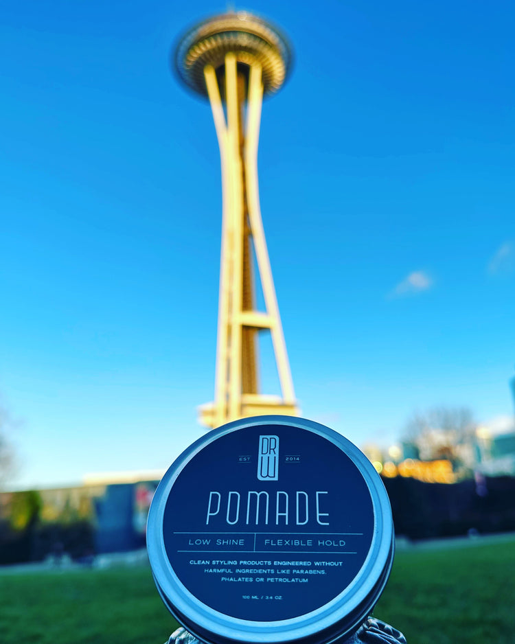 Dr. Watson's Pomade in front of Seattle Space Needle