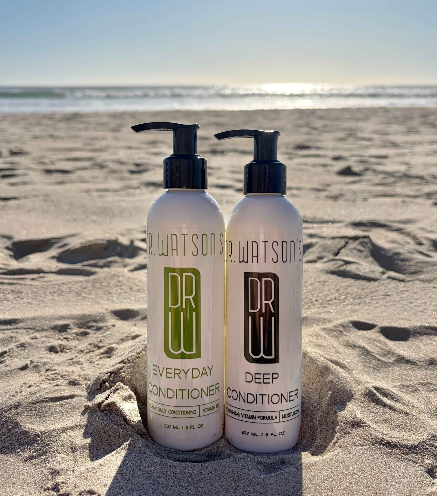 Conditioner duo: two white pump bottles with black nozzles, Everyday & Deep labels