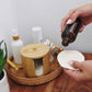 Bamboo storage box with hemp cotton rounds; hand holds a cotton round