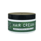 Dr. Watson's hair cream jar with black lid, white base and green label.