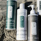 Trio of Dr. Watson's shampoo, conditioner, and body wash bottles