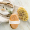 Oval dry brush with beechwood handle and yellow sisal bristles, white strap