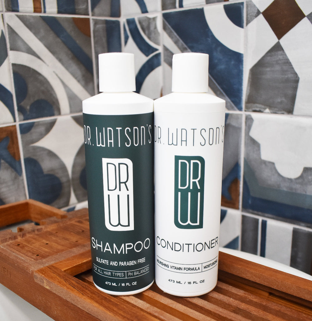 shampoo and conditioner bottles with tile background