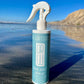 Sea salt spray bottle standing with white trigger sprayer, blue label details