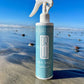 Sea salt spray bottle with white trigger sprayer and blue front label