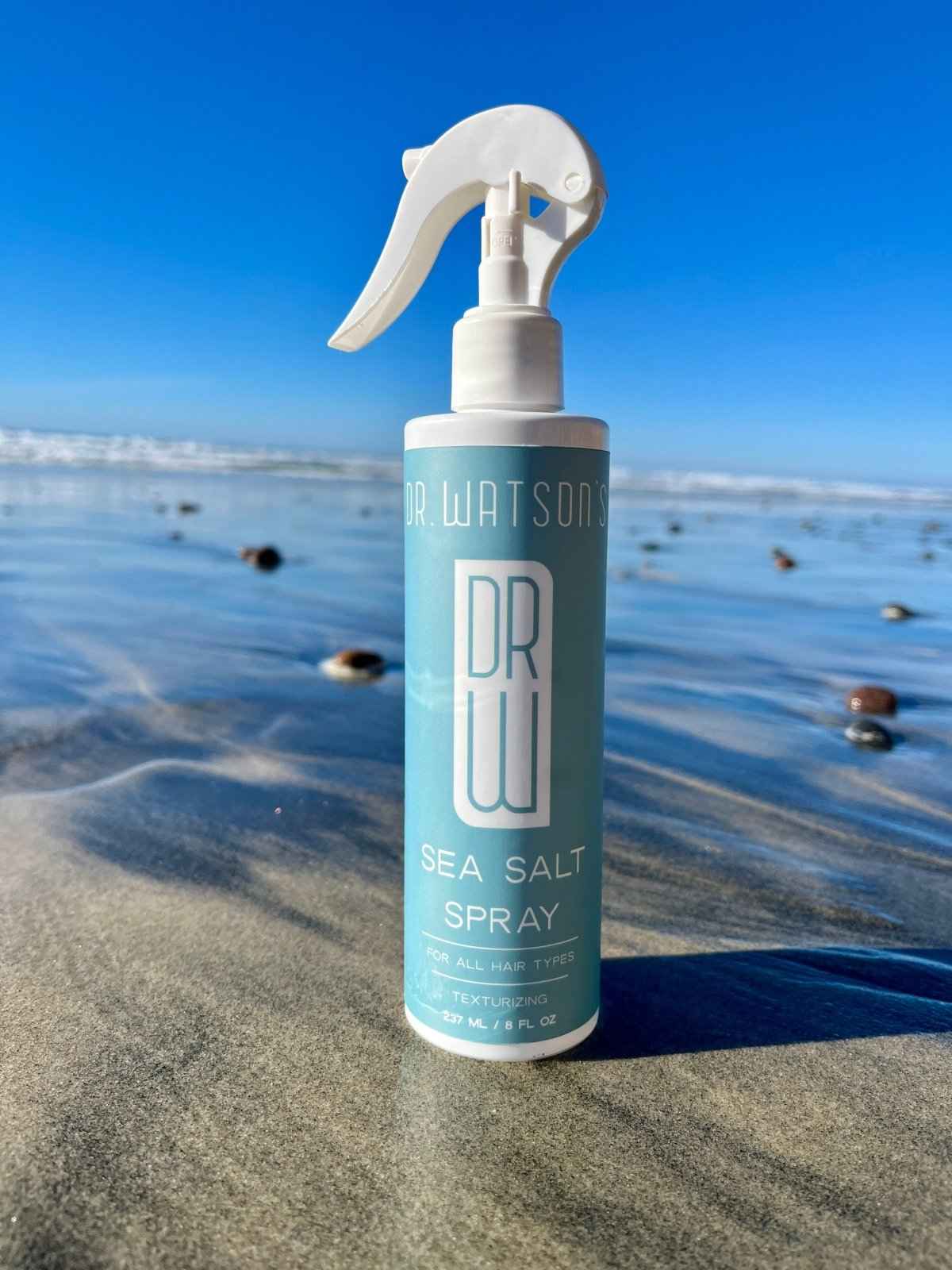 Sea salt spray bottle with white trigger sprayer and blue front label
