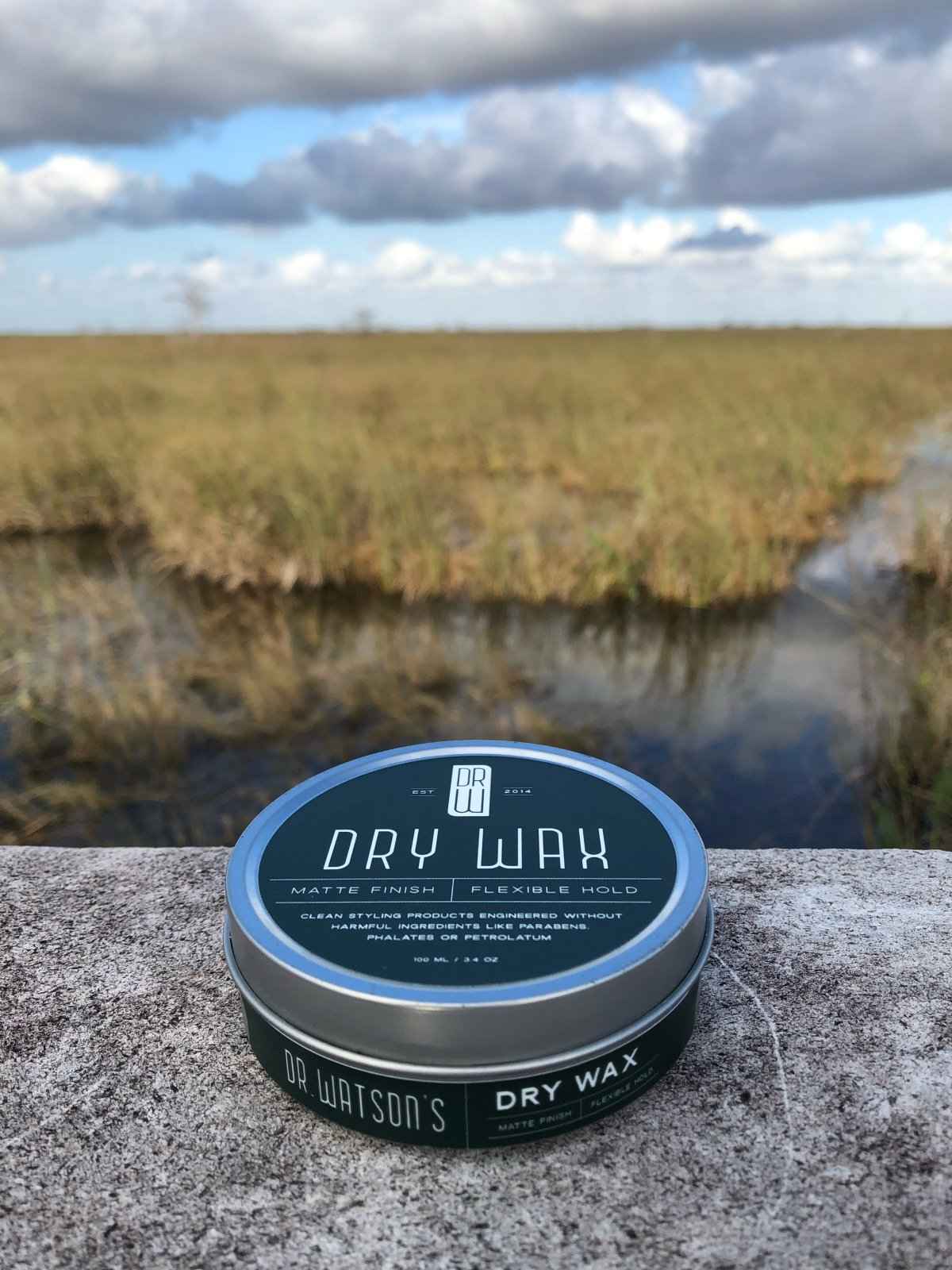 Hair dry wax tin with teal top label and silver rim