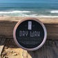 Hair dry wax tin with teal label and silver lid, flexible hold