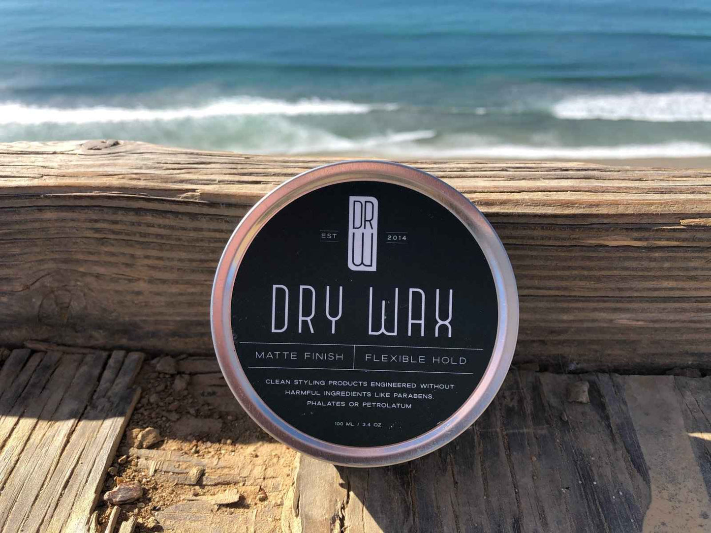 Hair dry wax tin with teal label and silver lid, flexible hold