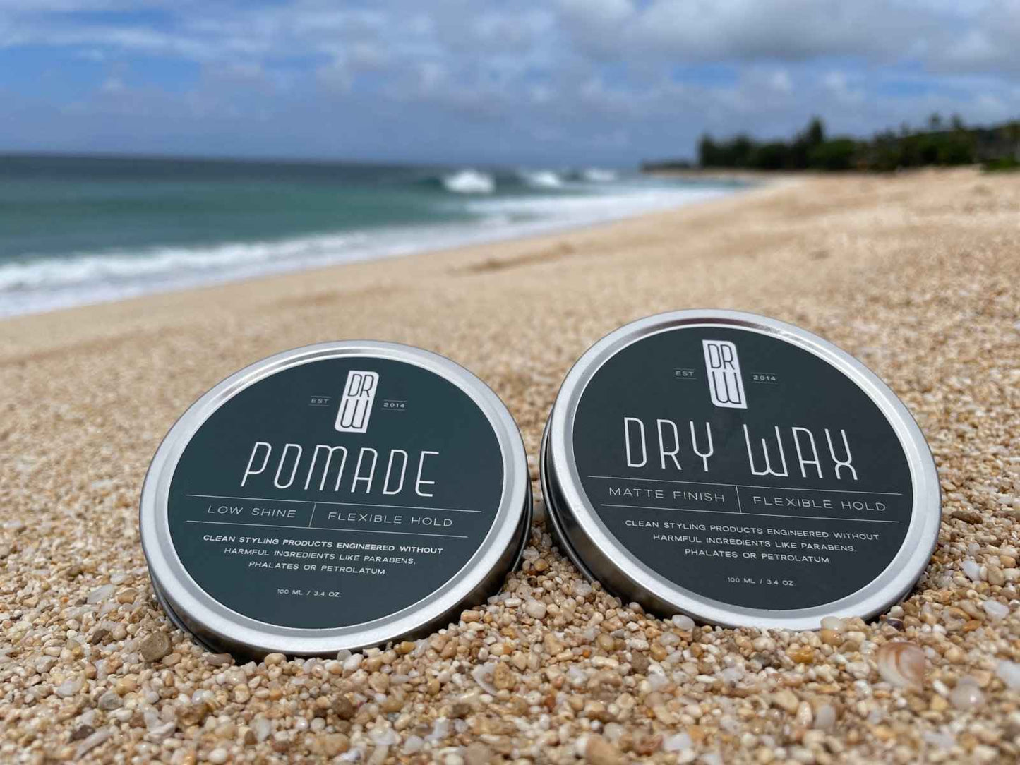 Hair dry wax jar with dark teal label and silver rim
