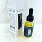 Hair oil bottle with dropper and tall white carton, dark cap and yellow oil