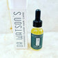 Hair oil bottle with dropper and white DR Watsons hair care box, yellow serum