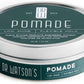 Hair pomade tin with dark green label, silver top and metal rim