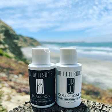 Two Dr. Watson's bottles: shampoo and conditioner, white caps